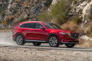 2022 Mazda CX-9 Soul Red navigating mountain road action shot