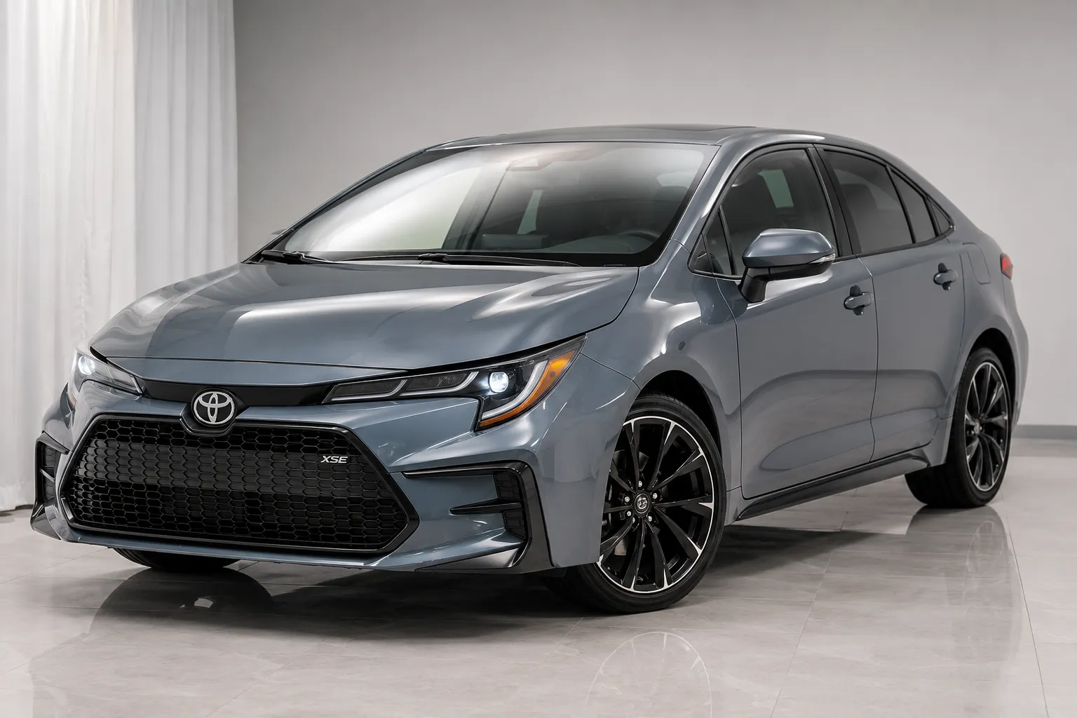 2026 Toyota Corolla Sedan Exterior 2026 Toyota Corolla sedan exterior front three-quarter view featuring aggressive angular styling and sporty mesh grille