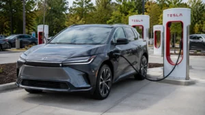 2026 Toyota bZ charging at a Tesla Supercharger